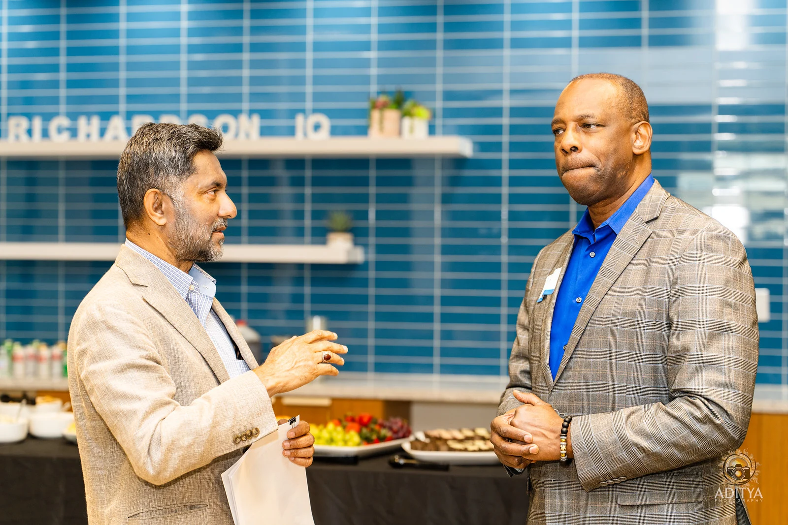 Two executives in conversation at Richardson IQ