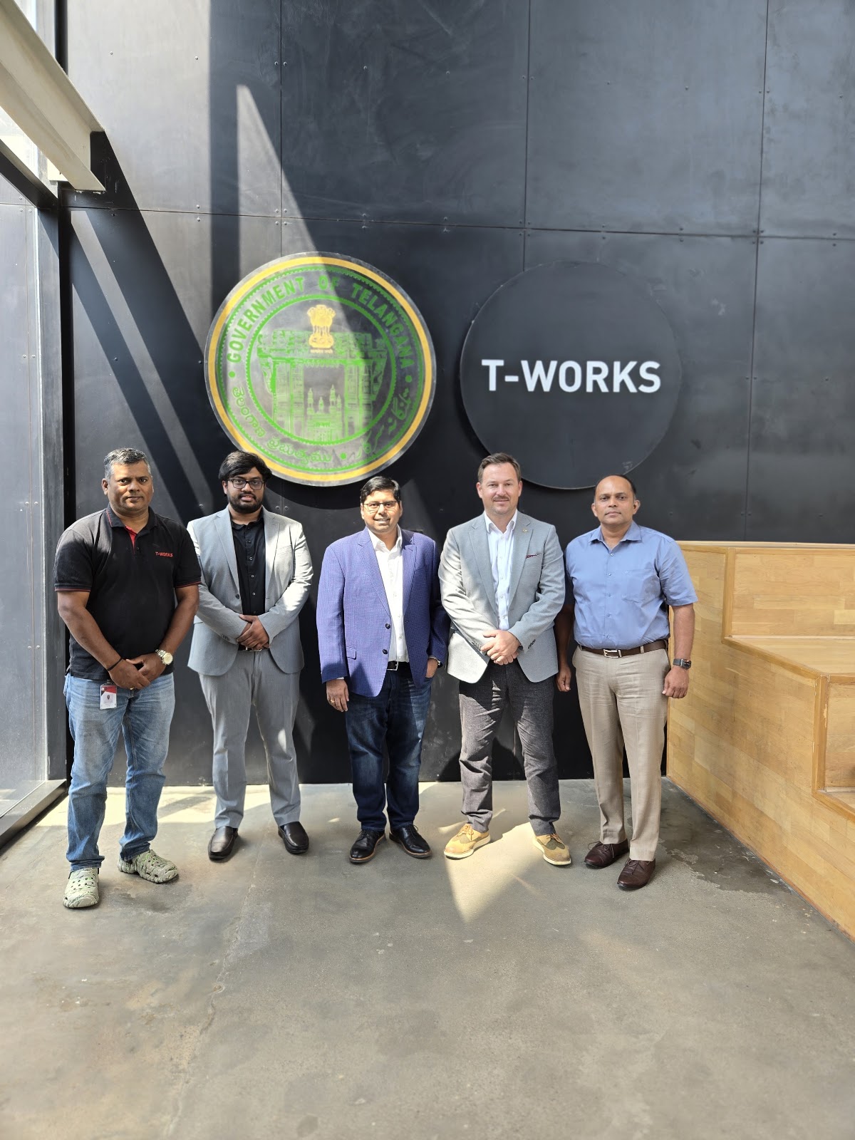 Mission group pictured beneath T-Works signage