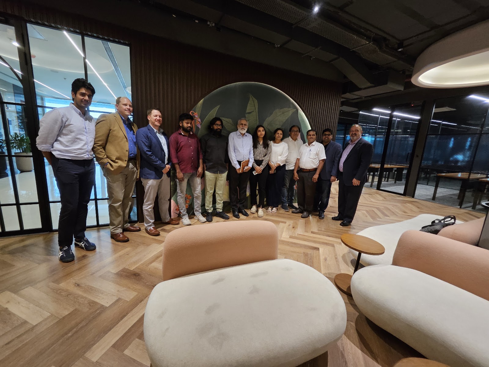 Mission group photographed in an indoor venue during the stated India mission