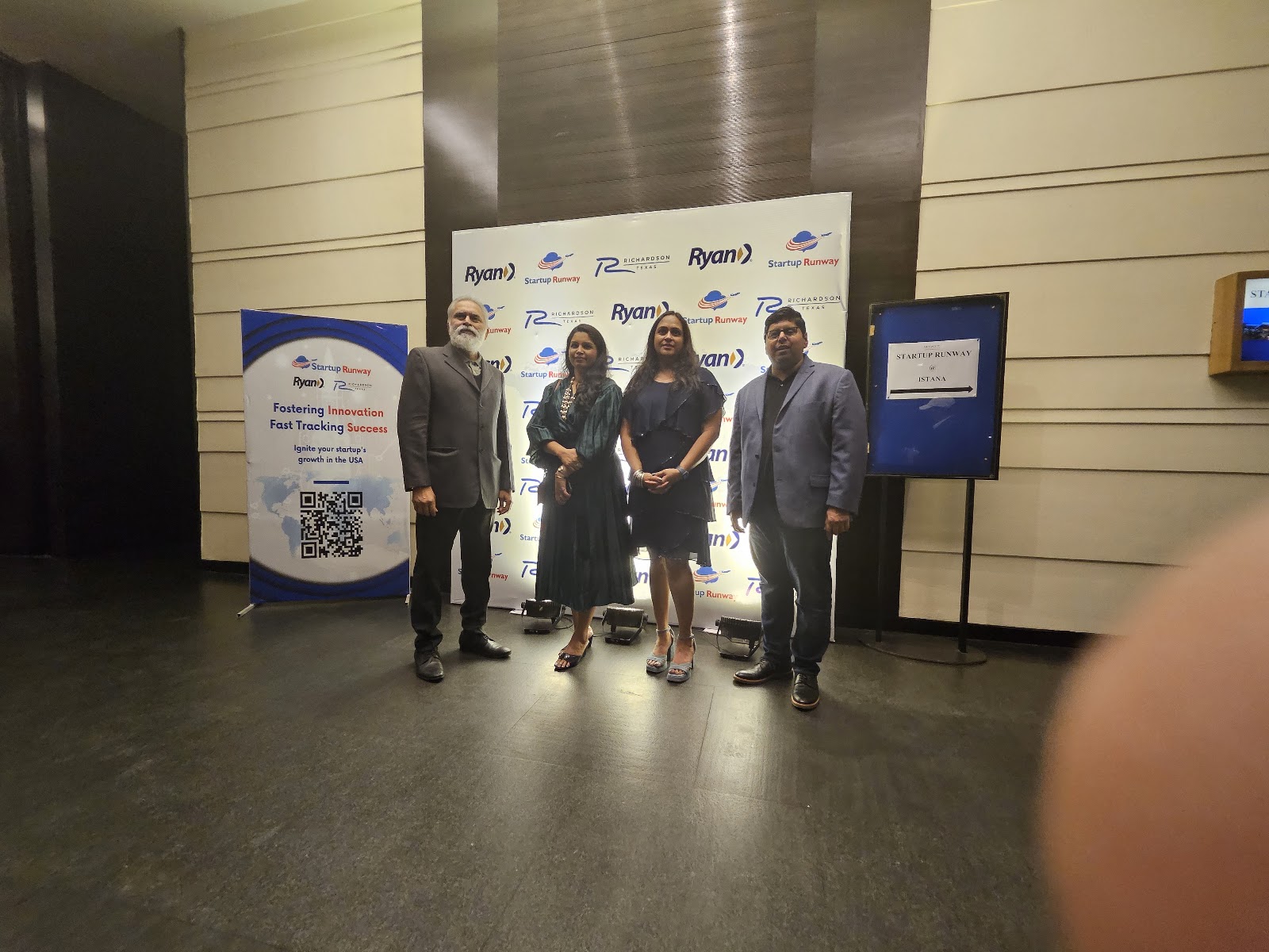 Mission attendees at an event wall carrying City of Richardson, Ryan, and Startup Runway branding